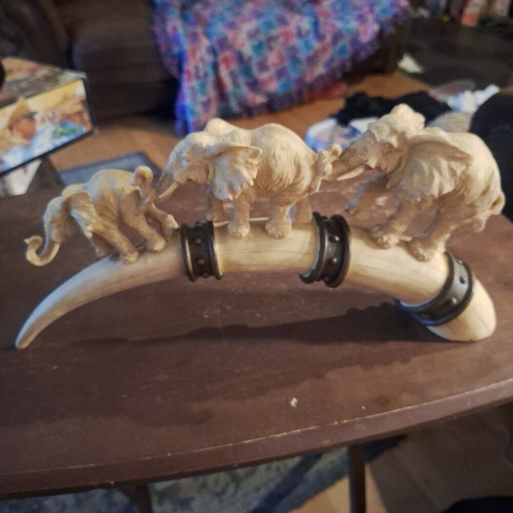 Elephant Family Sculpture, Calf, Mom, & Dad Walking on Bridge Shaped Like a Tusk